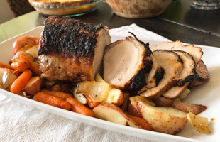 Pork Loin Roast with Veggies on a platter